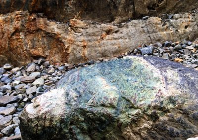 Multi-color rocks generously litter the trail up to Shadow Lake