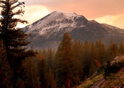 Hail covers mountain above a steaming Lake Mary